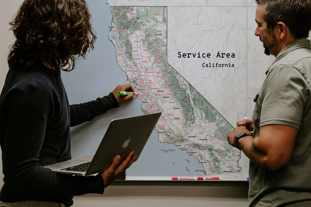 Custom dry erase service area map of California on an office wall