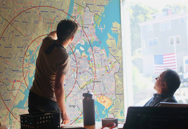 Dry erase wall map with radius circles marking service areas
